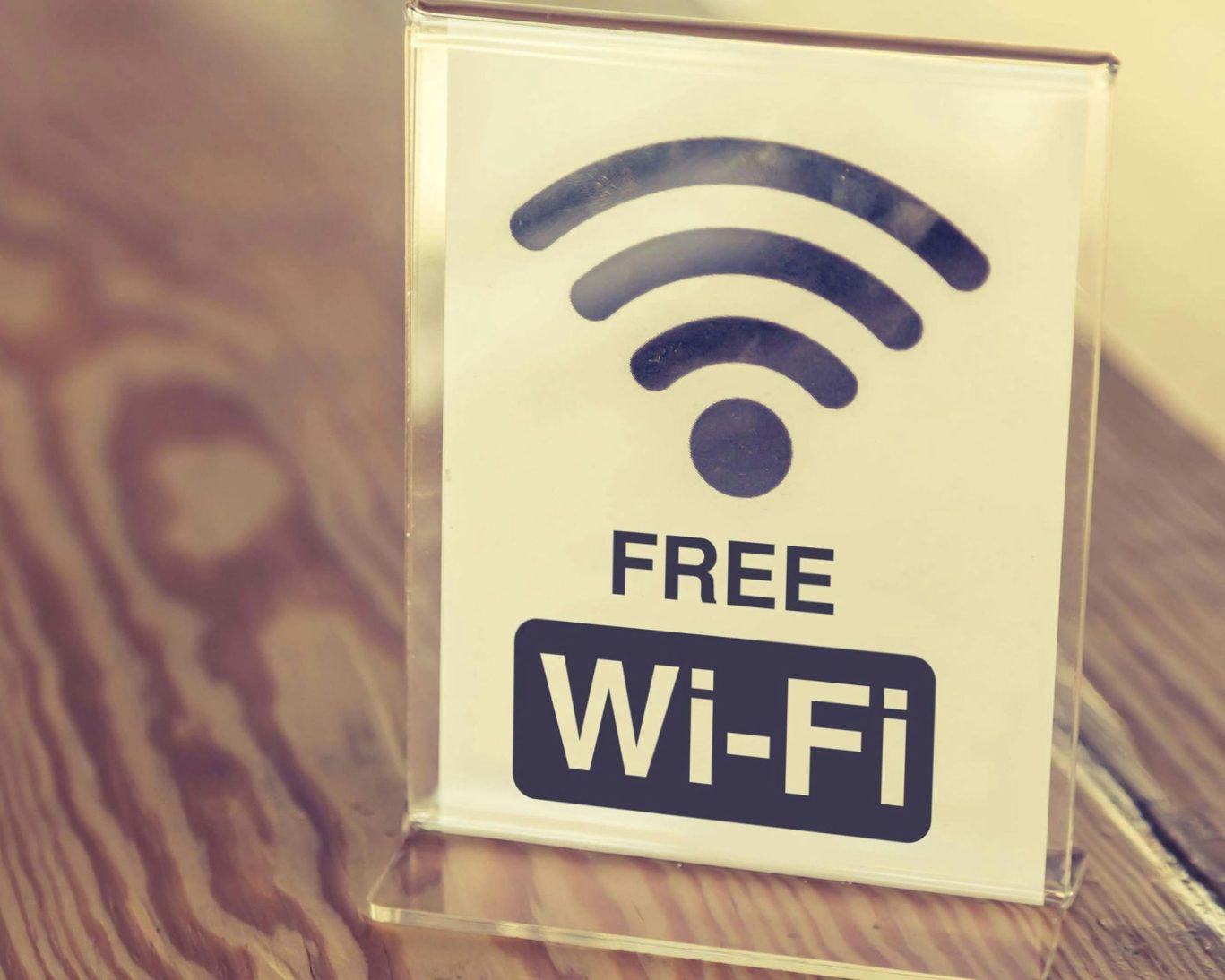 Table sign promoting free Wi-Fi available at the hotel for guests.