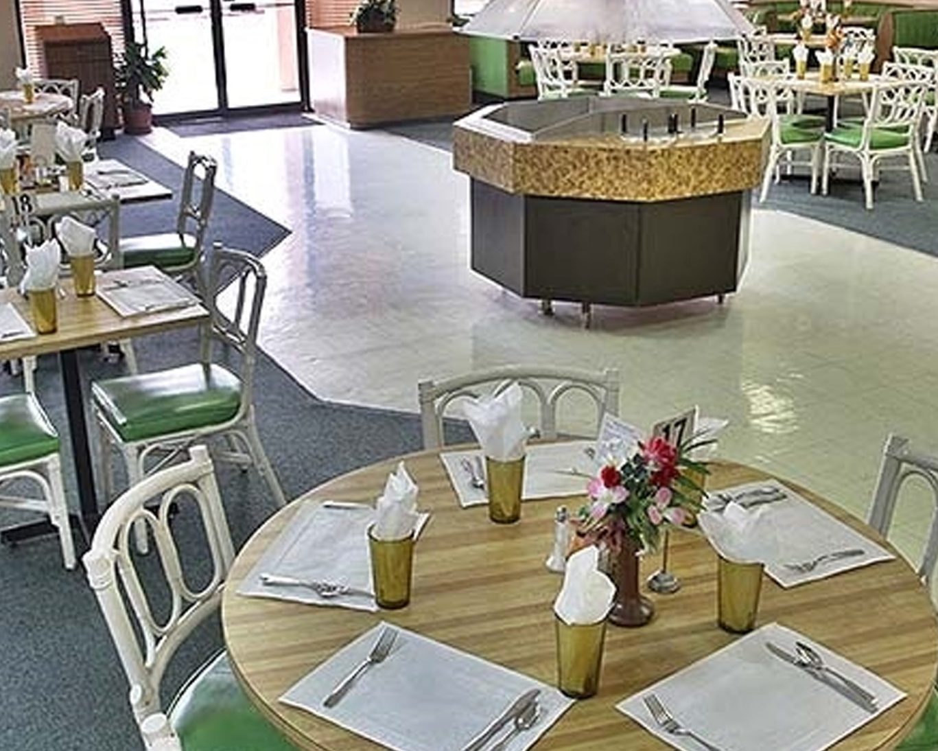 Bright and casual dining area at Castaways Resort with neatly set tables.