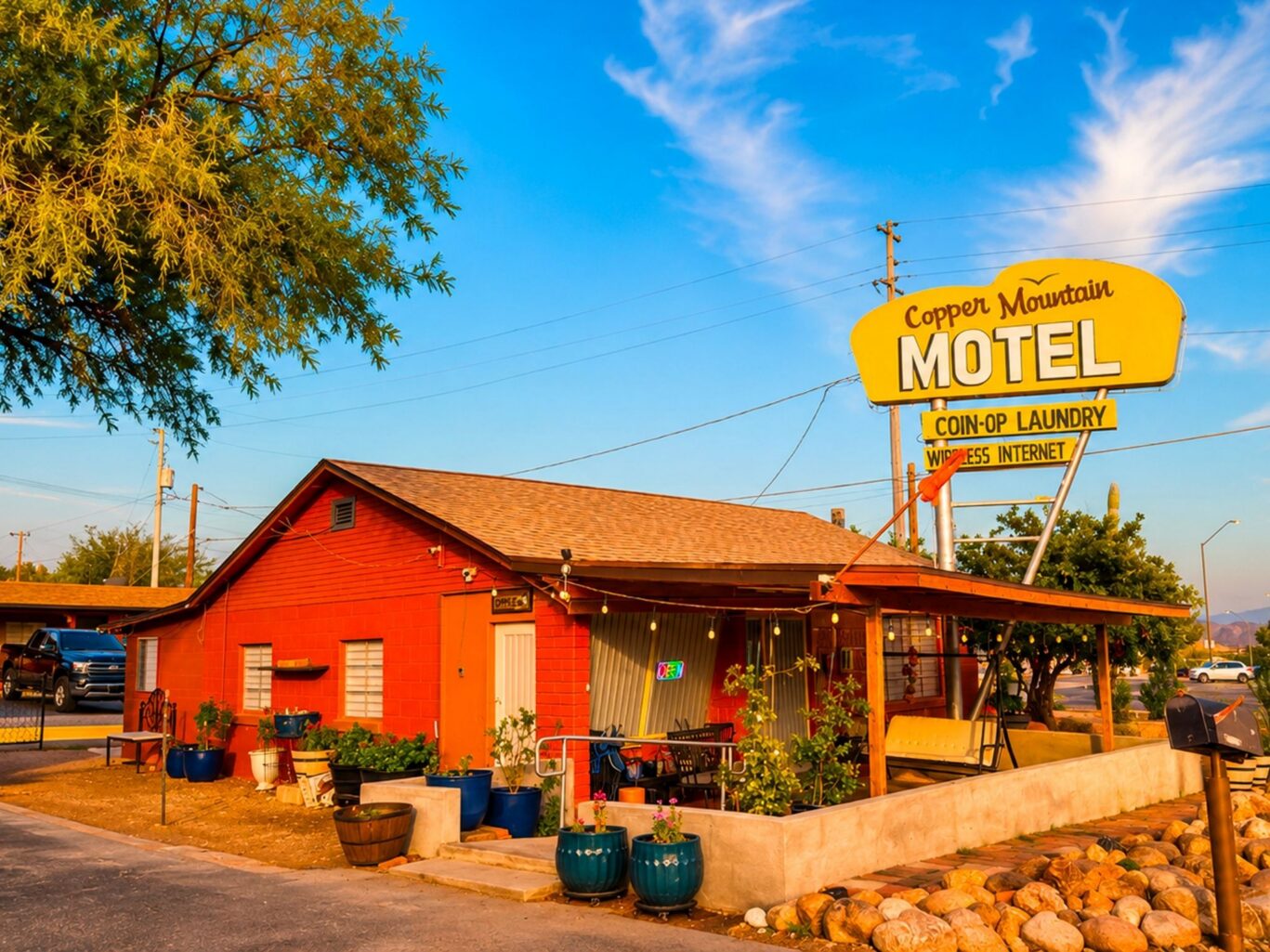 Exterior of Copper Mountain Motel office building with their logo.
