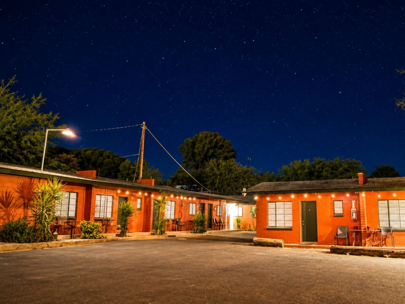Exterior of Copper Mountain Motel rooms with night sky views.