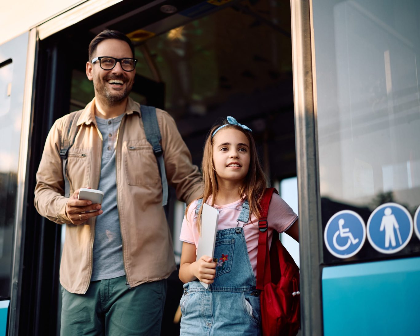 Father and daughter arriving at the Escondido Transit Center, offering easy access to local transportation.