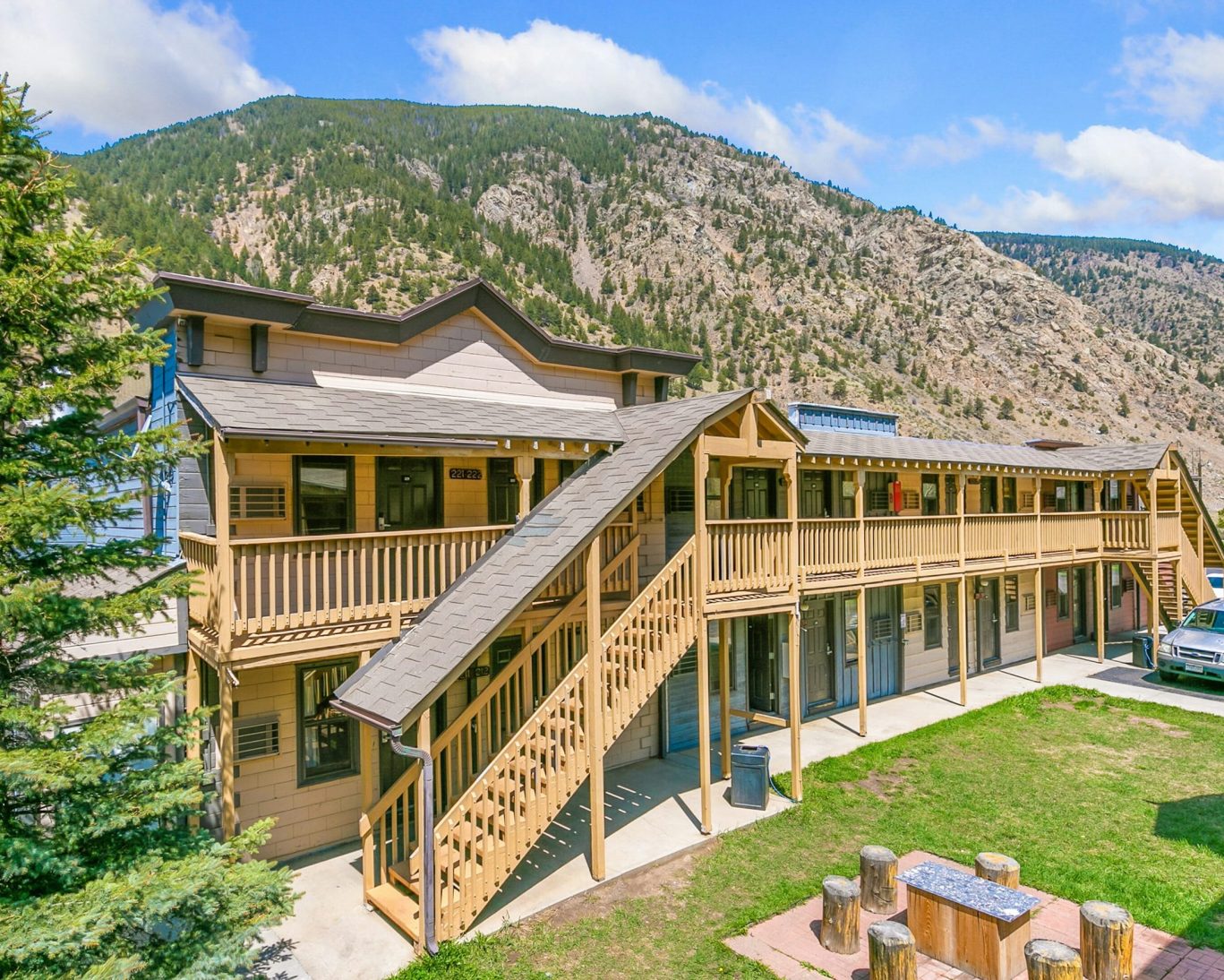 Two-story Georgetown Lodge exterior with mountain views and wooden balconies.