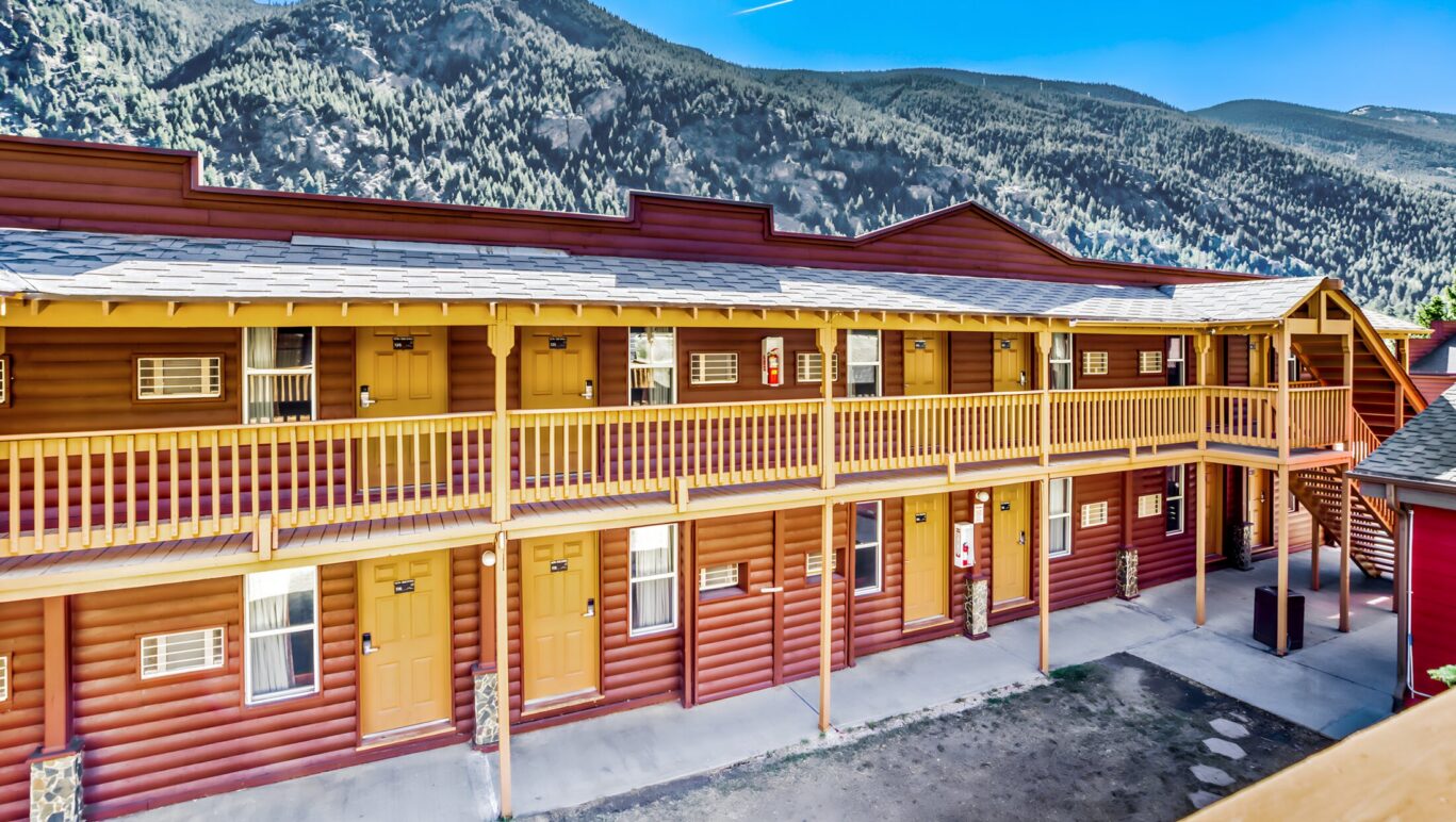 Upper-level guest room walkway at Georgetown Lodge with mountain views.