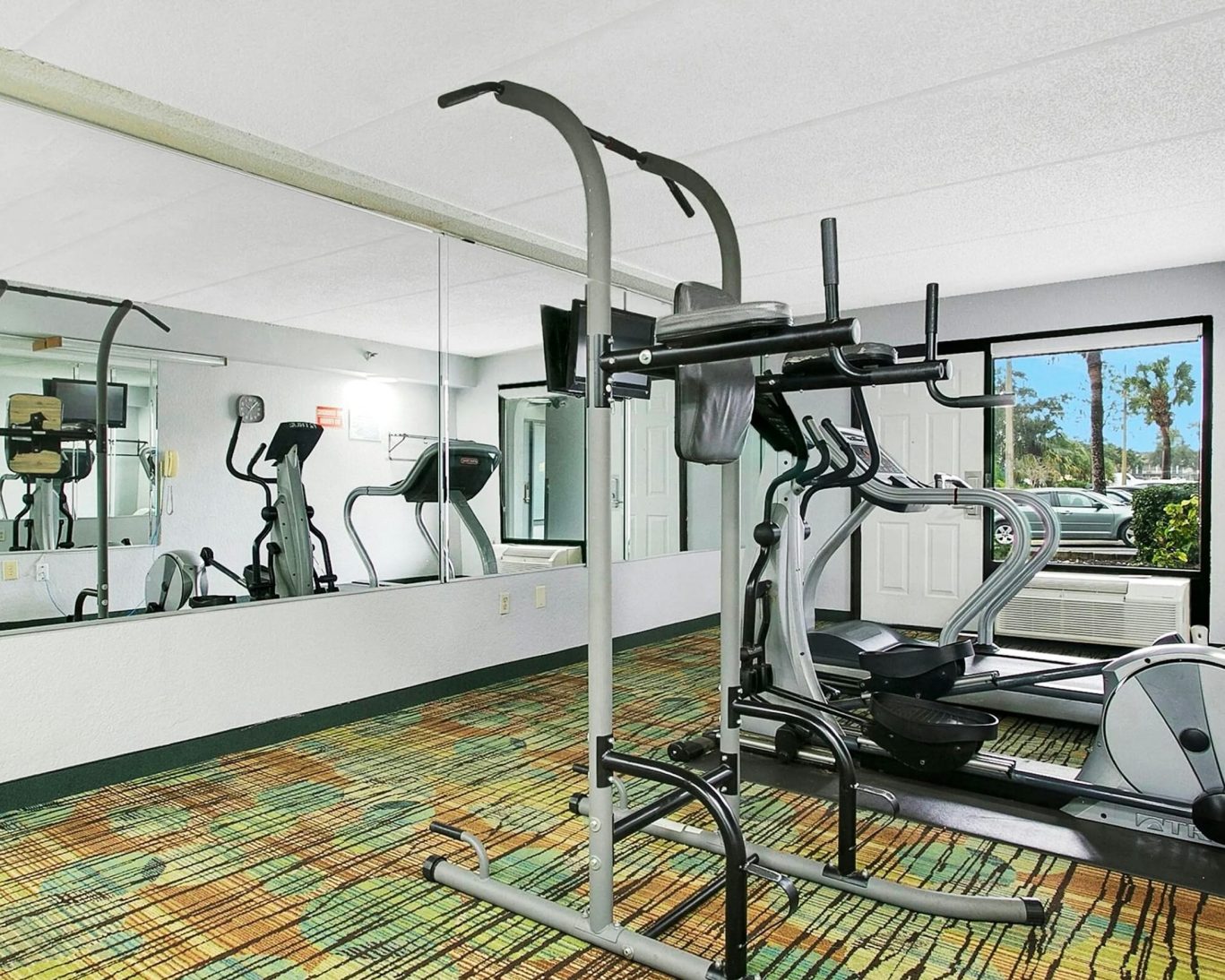 On-site fitness center with cardio and strength training equipment at H1 Extended Stay Kissimmee.