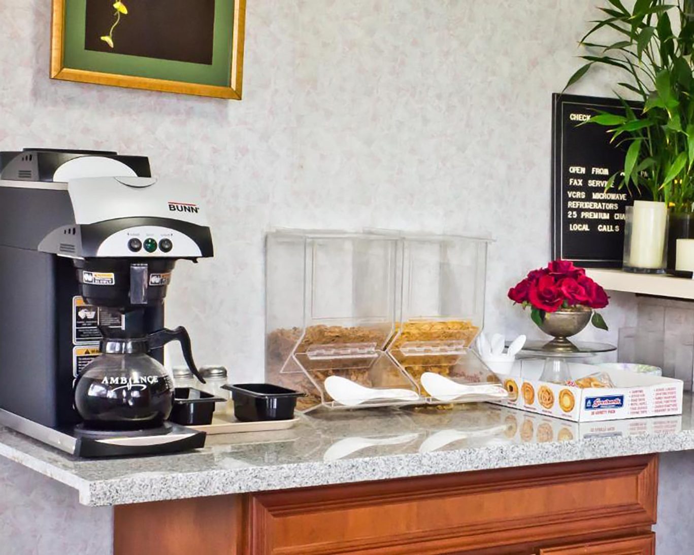 Complimentary breakfast station at Valley Inn San Jose with coffee maker, cereal, and pastries.