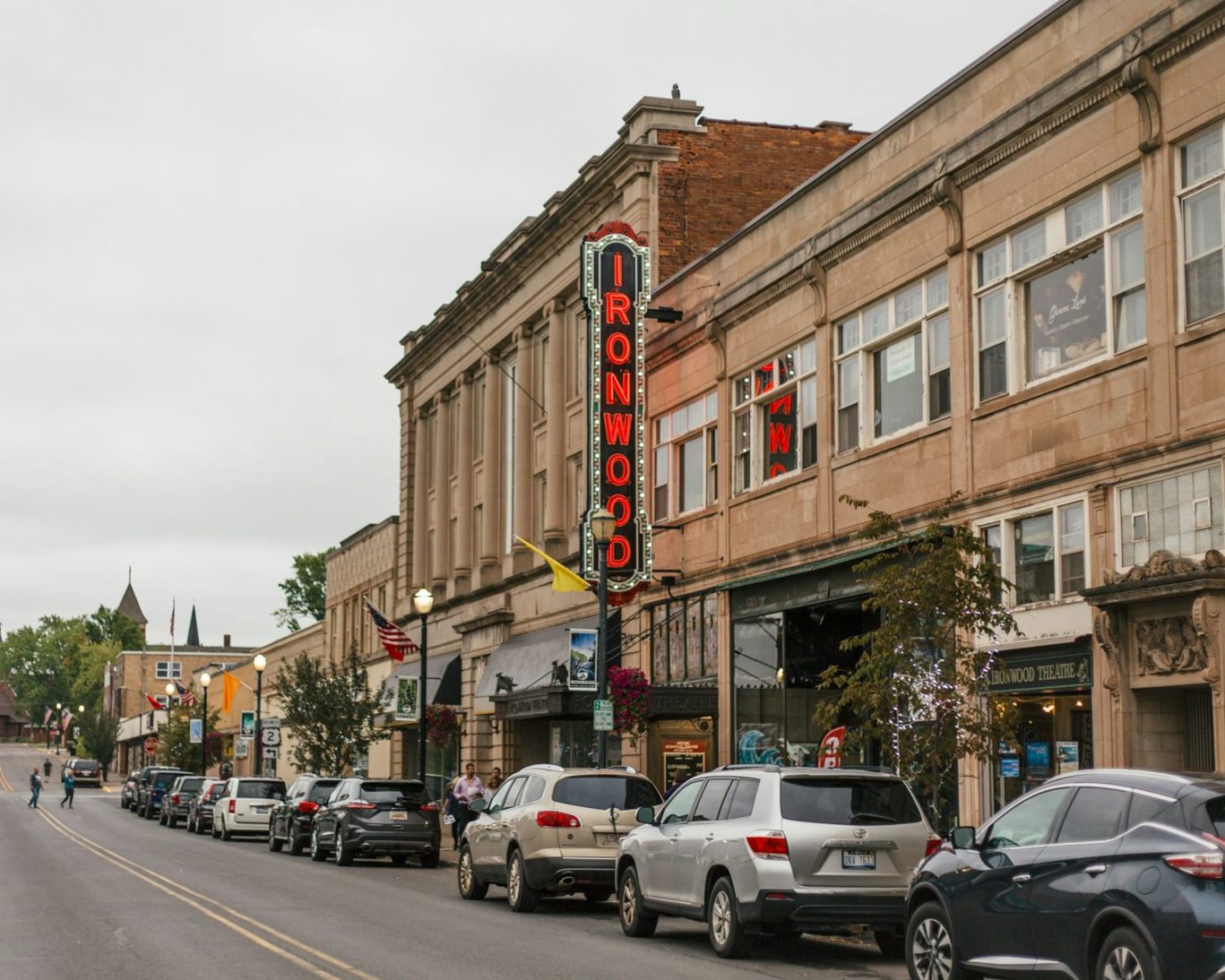 Historic downtown Ironwood, Michigan featuring the Ironwood Theatre and local shops along a busy main street.