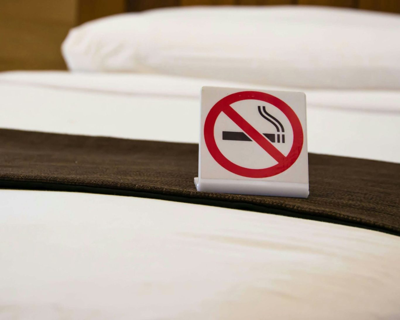 Clean non-smoking room at Judy's Motel Bedford Pennsylvania with no smoking sign on bed.