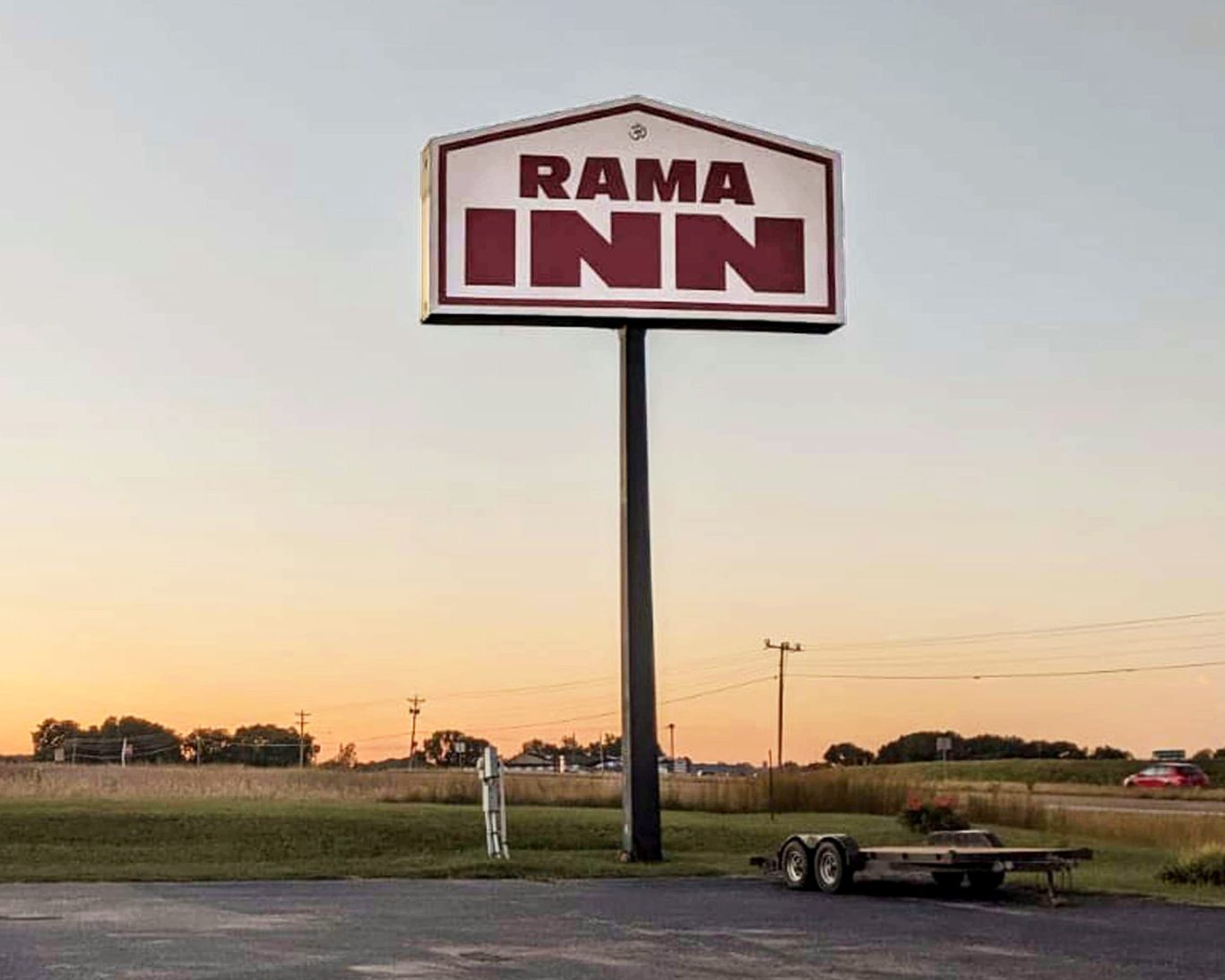 Rama Inn roadside sign at sunset on Highway 412 in Bells, Tennessee.