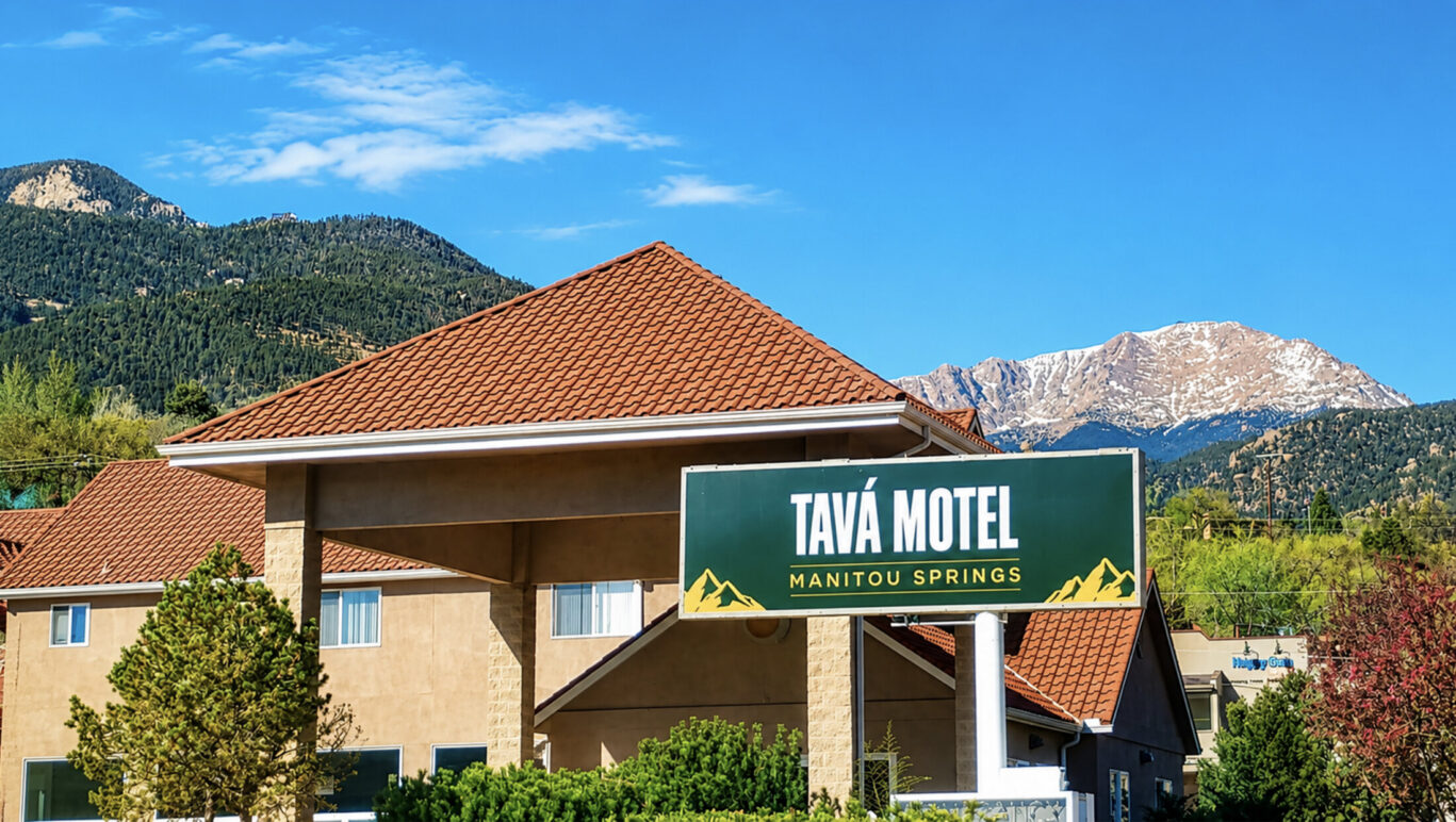 Tava Motel exterior view of the building and hotel logo
