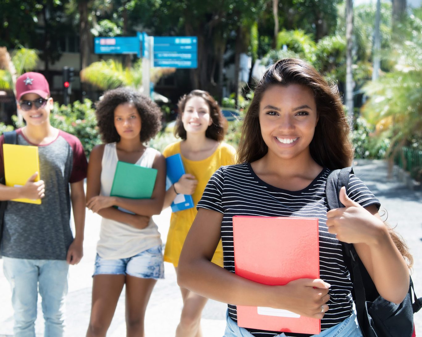 Happy students walking near College of San Mateo campus
