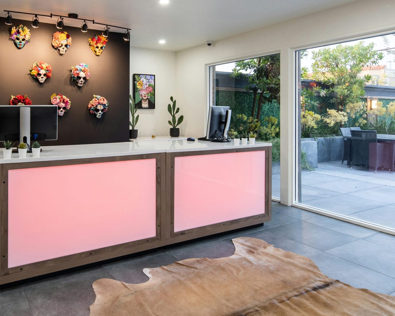 Reception area at The Catrina Hotel with Day of the Dead art and cactus decor