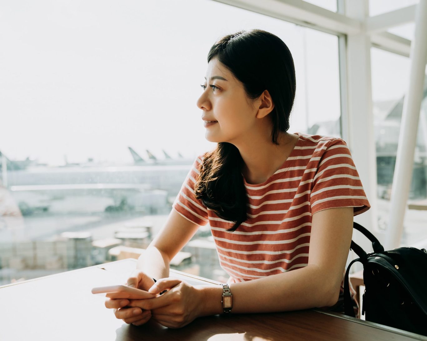 Traveler at San Francisco International Airport terminal window