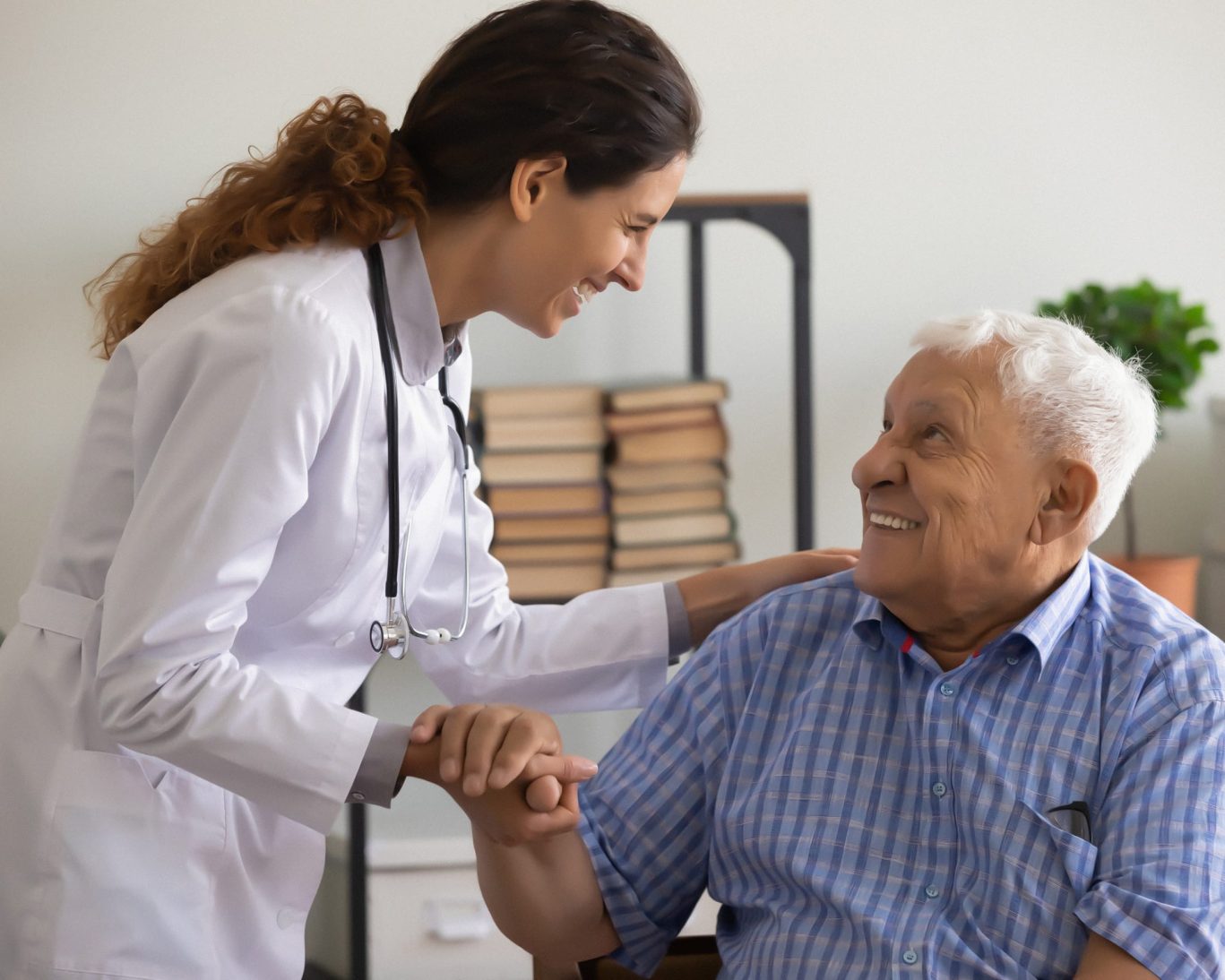 Doctor smiling with elderly patient at San Mateo Medical Center
