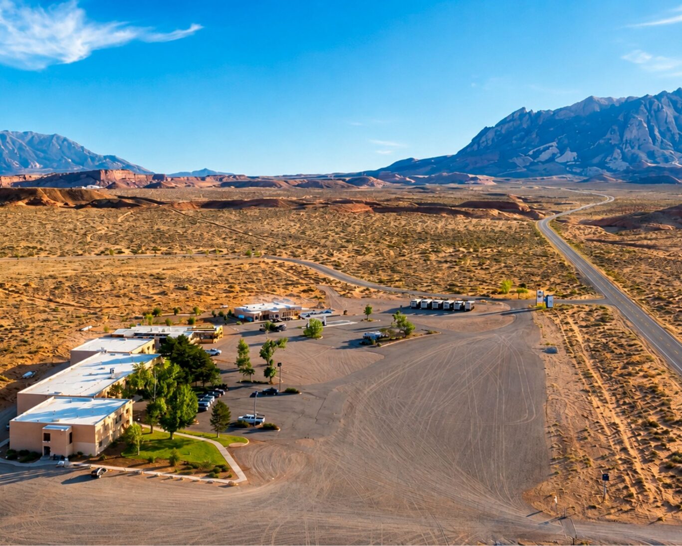Aerial view of Ticaboo Lodge surrounded by desert landscape and scenic Utah mountains