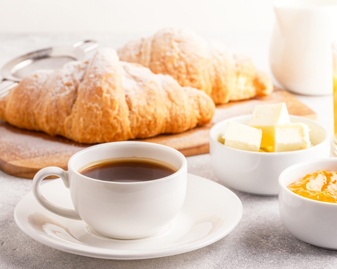 Continental breakfast at Western Motel Fitzgerald with fresh croissants, butter, coffee, and juice