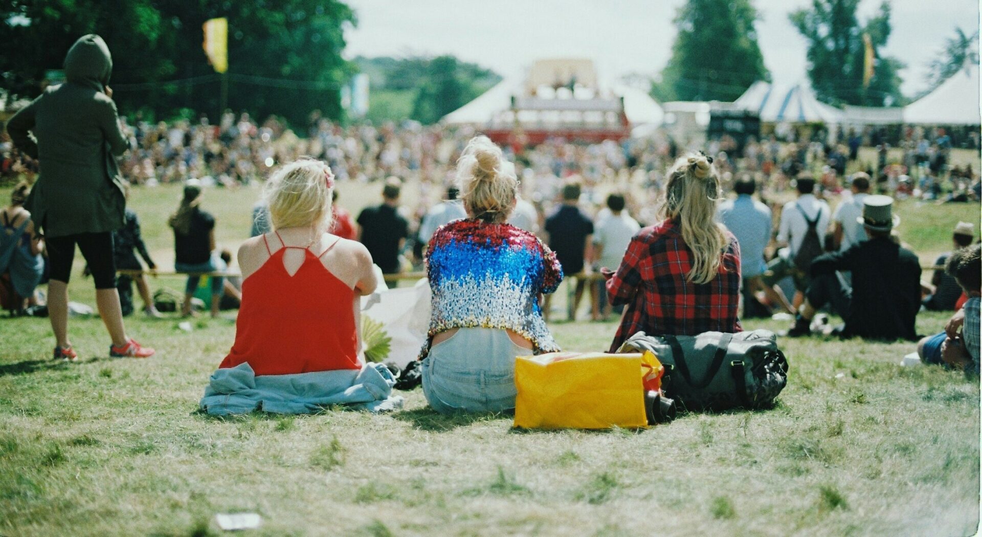 three women at a festival
