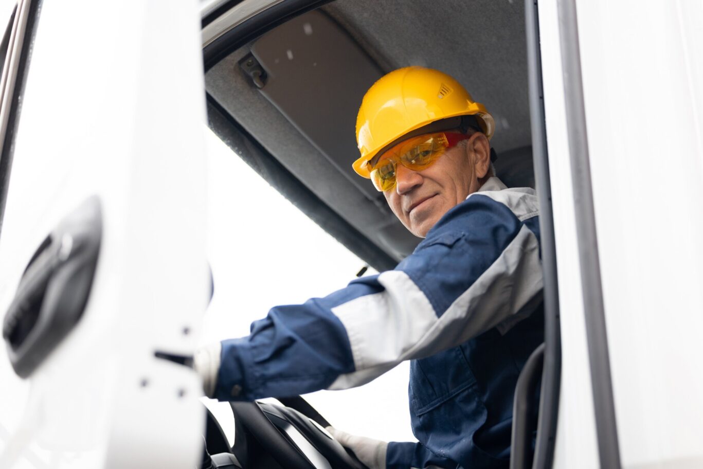 Gentleman in yellow hat working in construction