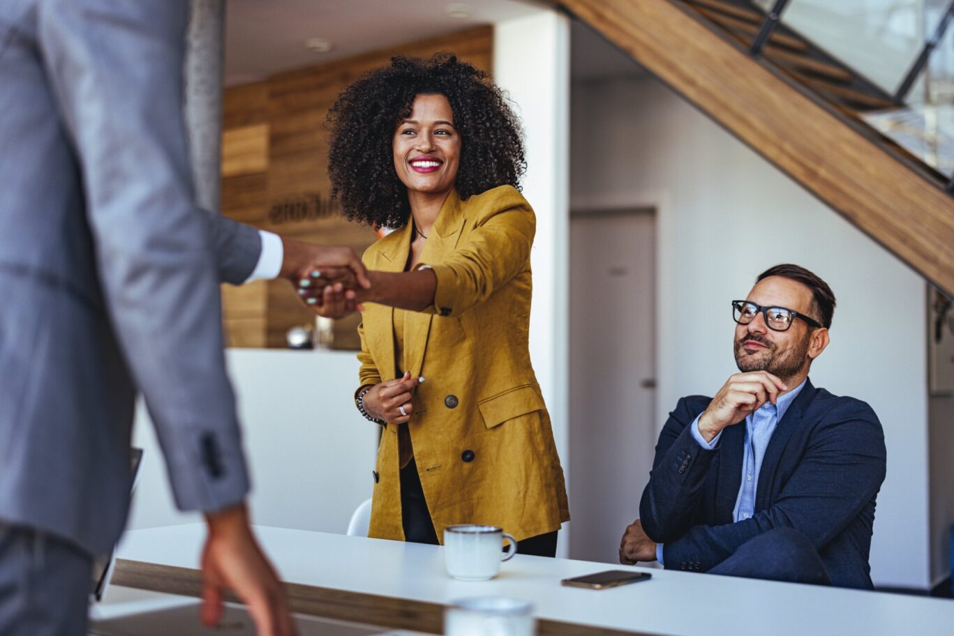 A,Professional,Business,Meeting,Featuring,A,Confident,Handshake,Between,Colleagues.